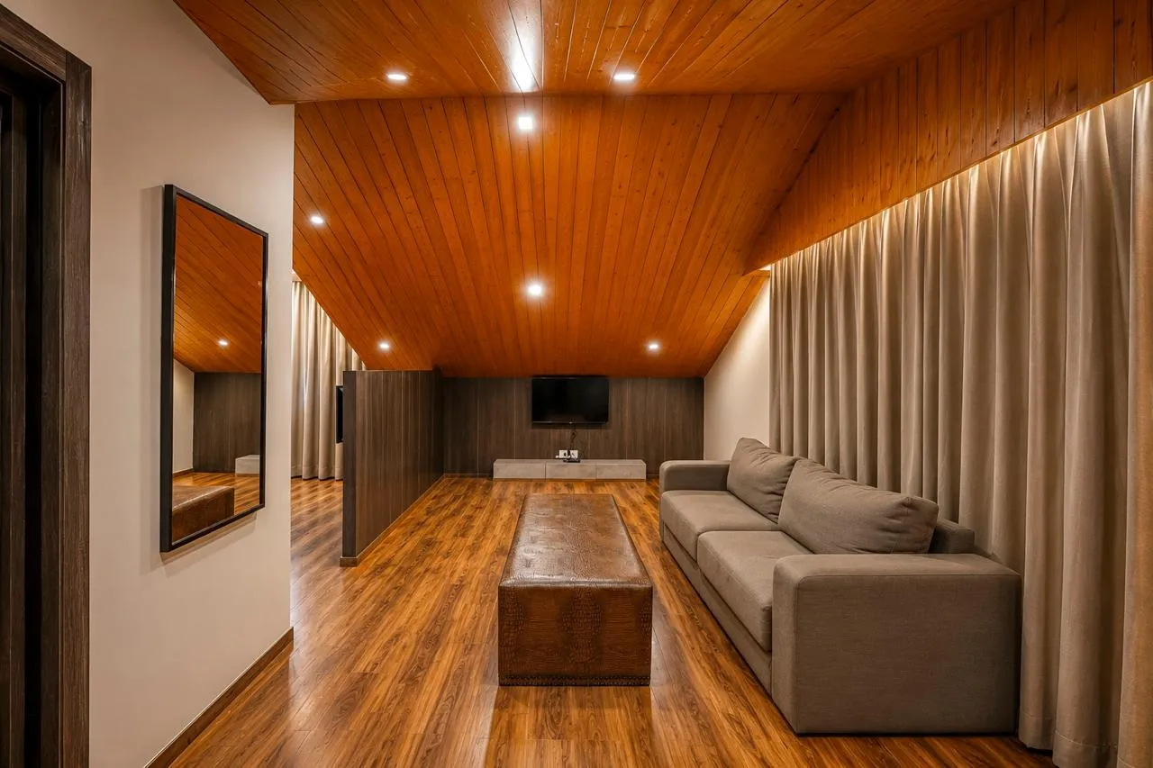 Wood-lined living room with a grey sofa